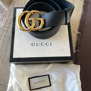 Gucci Black and Gold Leather Belt with Iconic GG Buckle